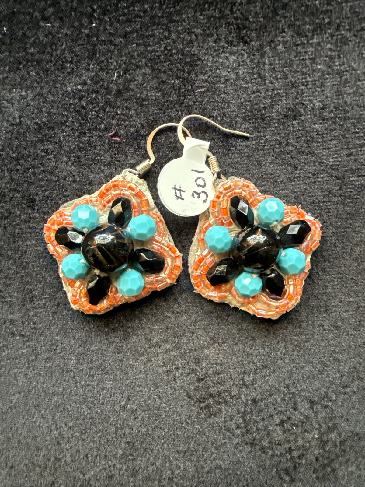 #301 hand, crystal, turquoise, black, and peach braided earrings