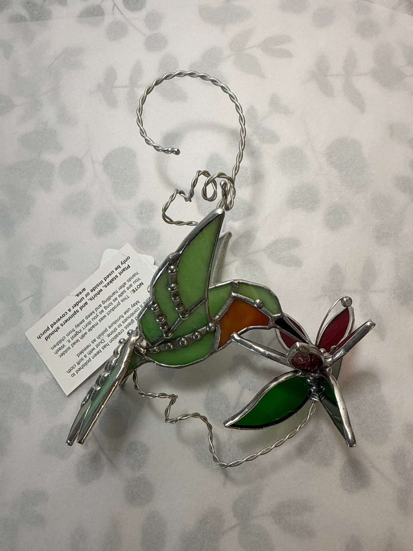 Hummingbird with flower flair tail