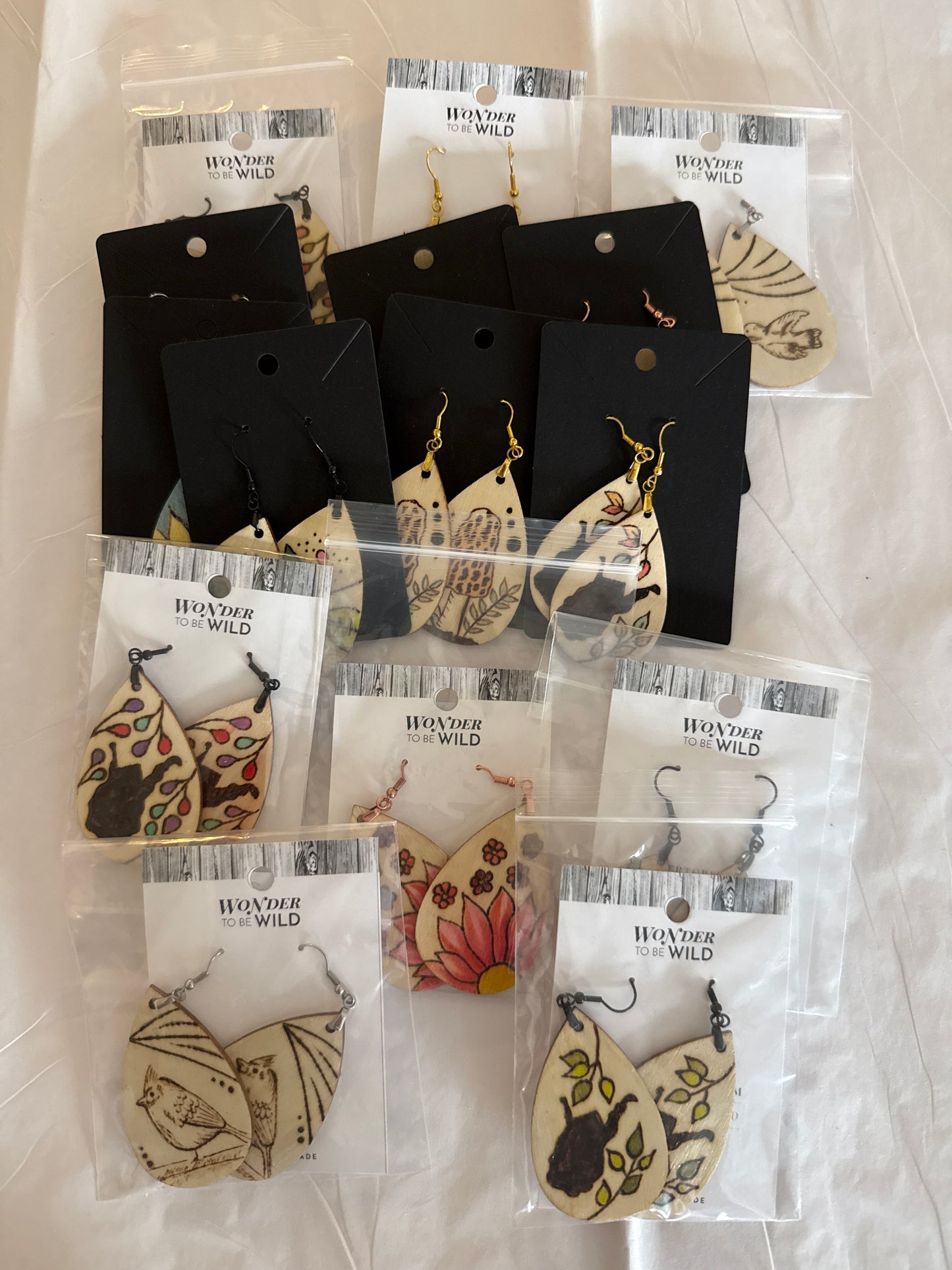 Earrings would burned assorted design