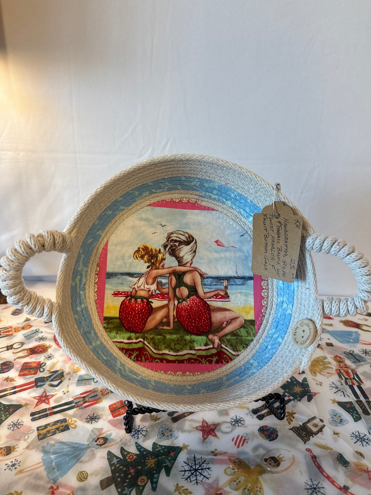 Handcrafted rope and fabric bowl with twist handles and fruit bottom gals