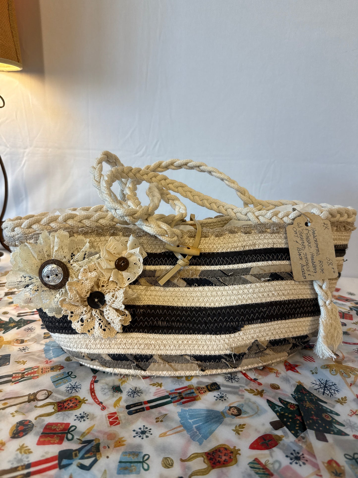 Handcrafted rope and fabric handbag with braided straps and oat and black accents