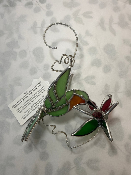 Hummingbird with flower flair tail